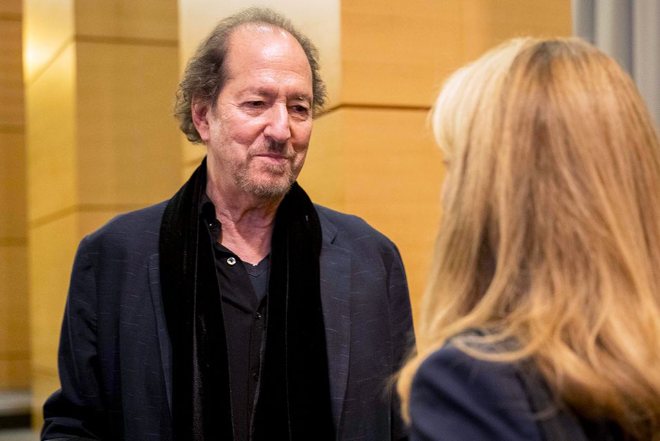 MSK patient Michael Wolff smiles while in conversation with another person.  