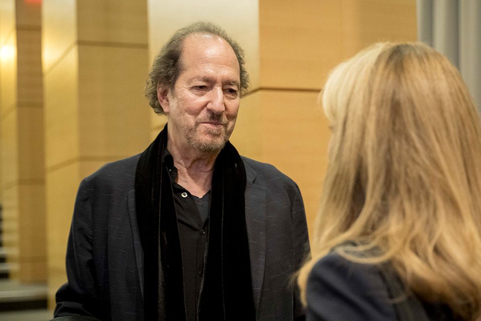 Michael Wolff in conversation with another person.  